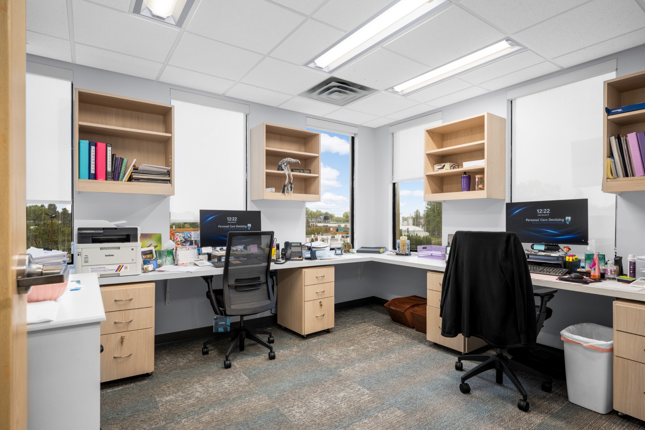 Bright office workspace with large windows
